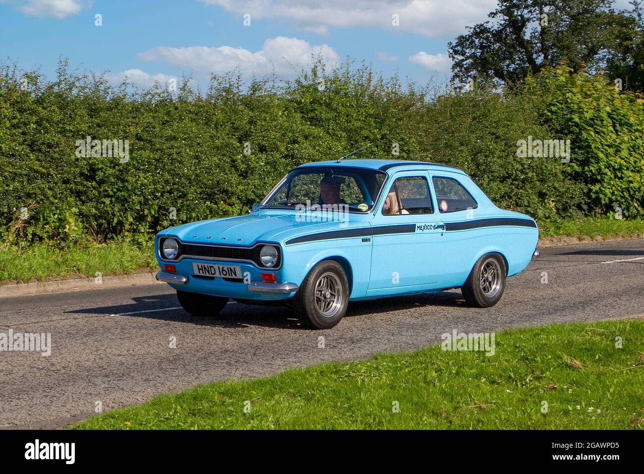 1975, 70s, 1970s, blue Ford Escort Mexico classic vintage car arriving at the Capesthorne Hall classic car show. Stock Photo