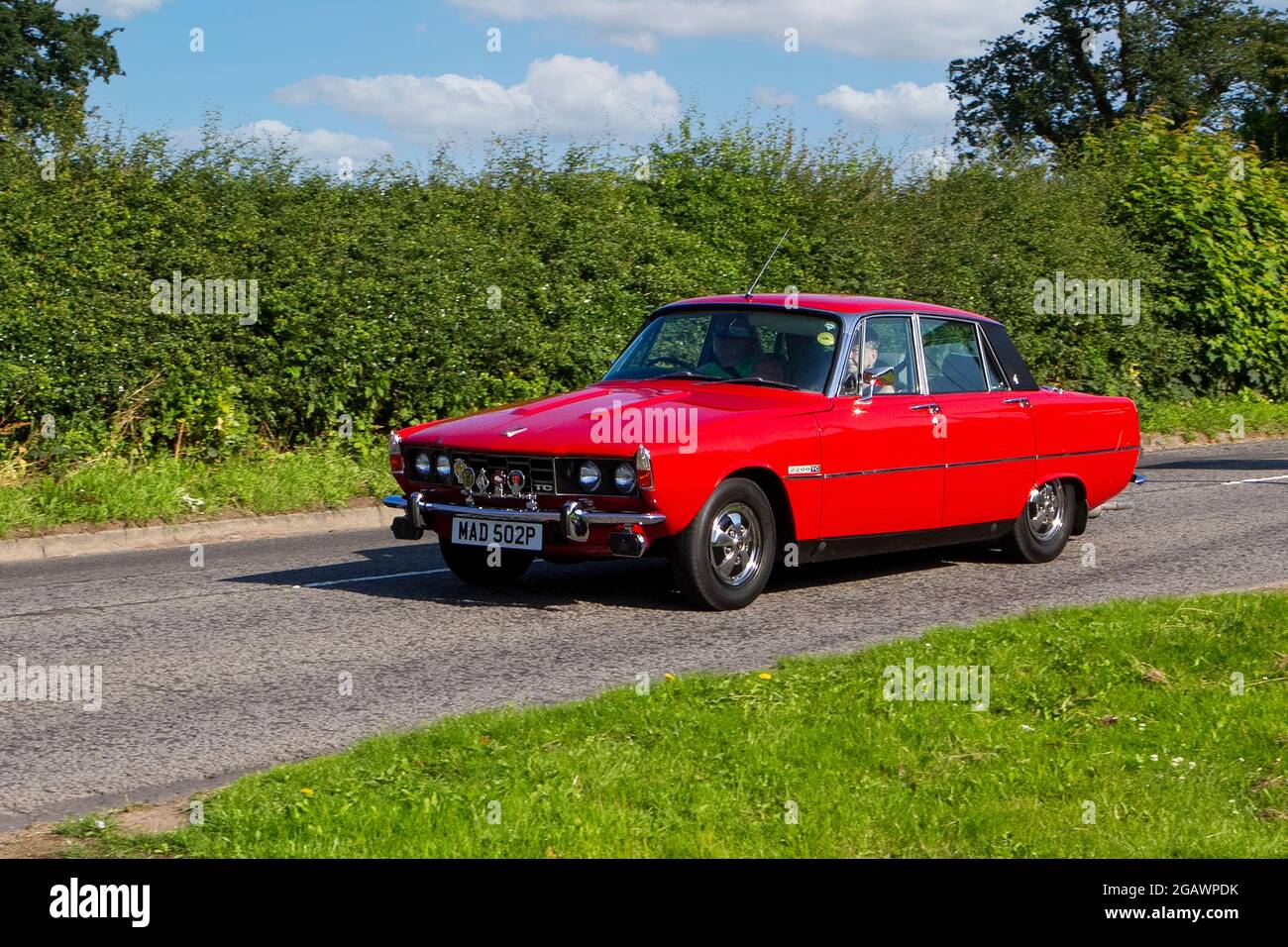 1976, 70s, 1970s red Rover P6 saloon classic vintage car arriving at the Capesthorne Hall classic car show. Stock Photo