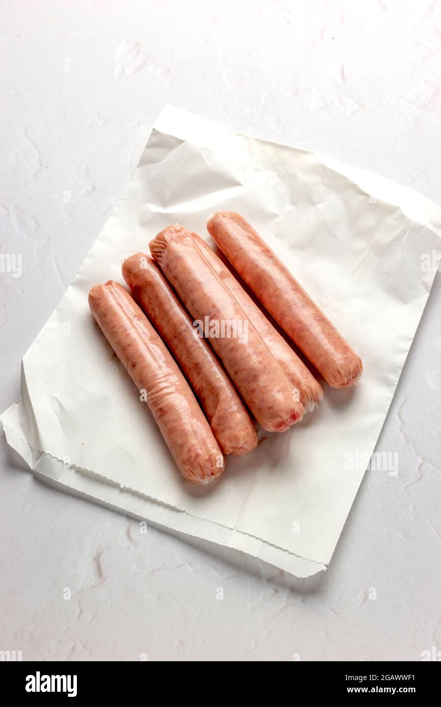 Raw Uncooked Sausages Ready to be Cooked for Breakfast – FOODPIX WHITE SERIES – COPYSPACE Stock Photo