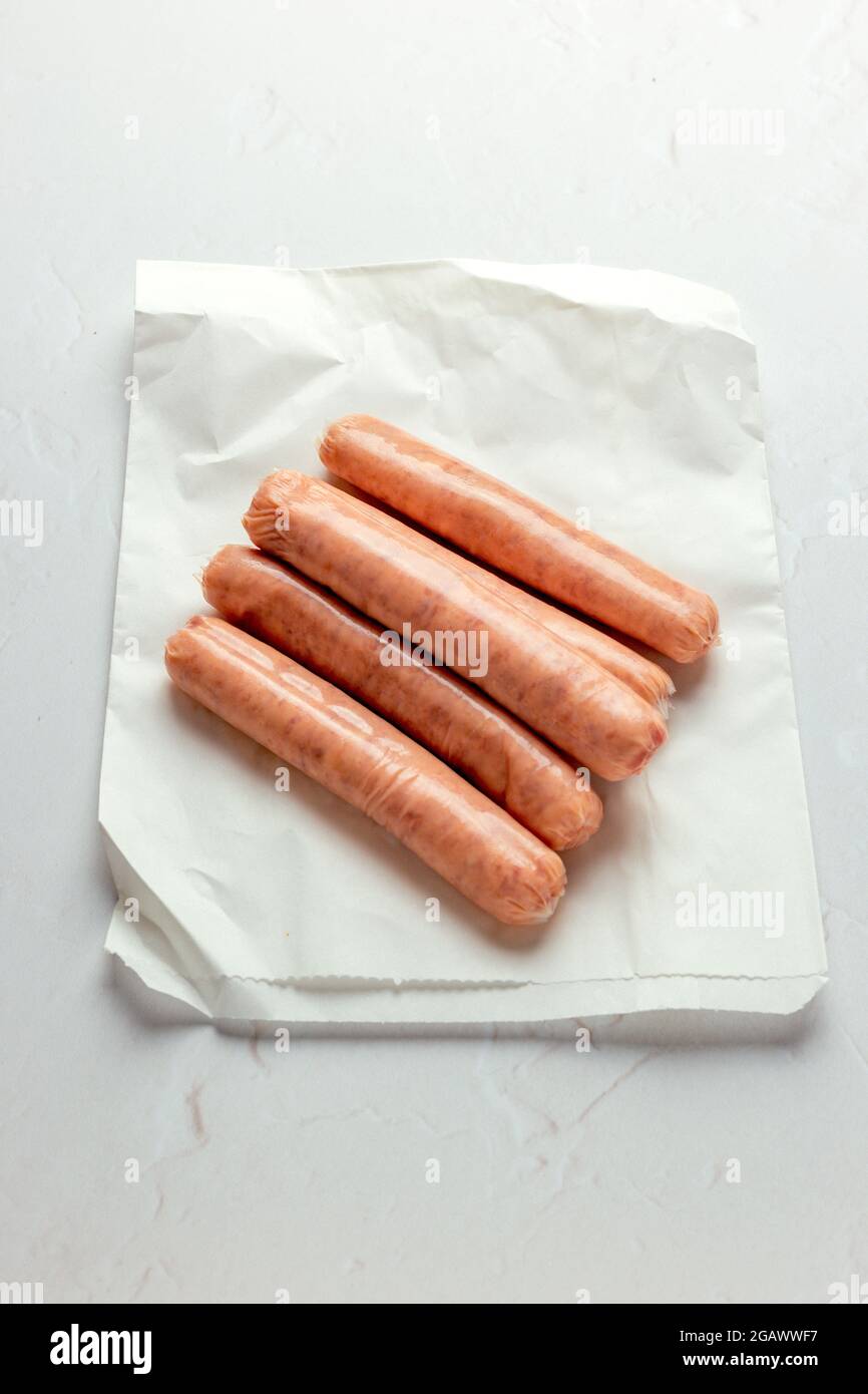 Raw Uncooked Sausages Ready to be Cooked for Breakfast – FOODPIX WHITE SERIES – COPYSPACE Stock Photo