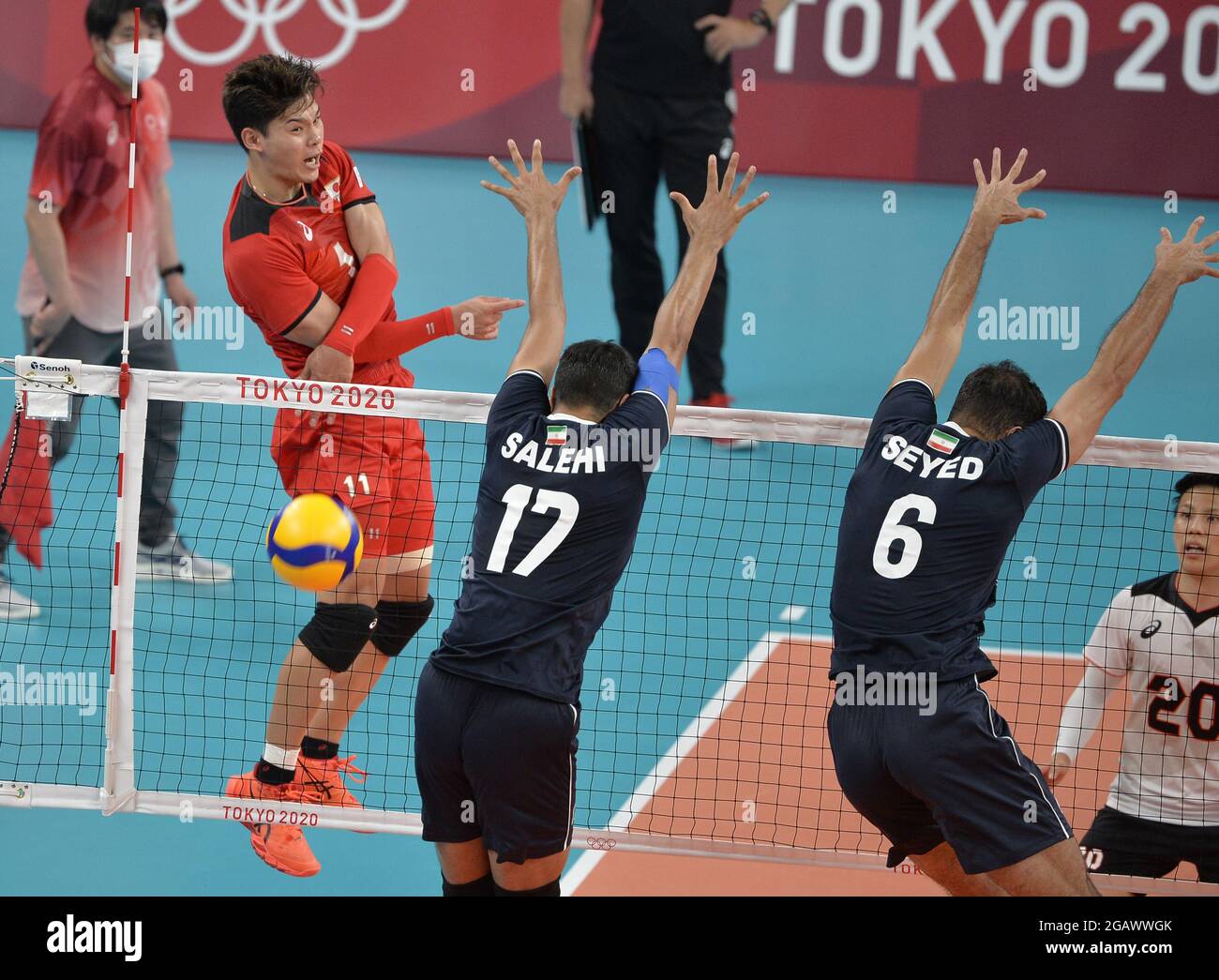 Tokyo, Japan. 01st Aug, 2021. Japan's Yuji Nishida (L) spikes the ball over Iran's defenders Melsam Salehi (17) and Seyed Mohammad Mousavi Eraghi (6) during Men's volleyball competition at the Tokyo 2020 Olympics, Sunday, August 1, 2021, in Tokyo, Japan. The match went to five sets, Japan winning 25-21, 20-25, 29-31, 25-22 and 15-13. Photo by Mike Theiler/UPI Credit: UPI/Alamy Live News Stock Photo