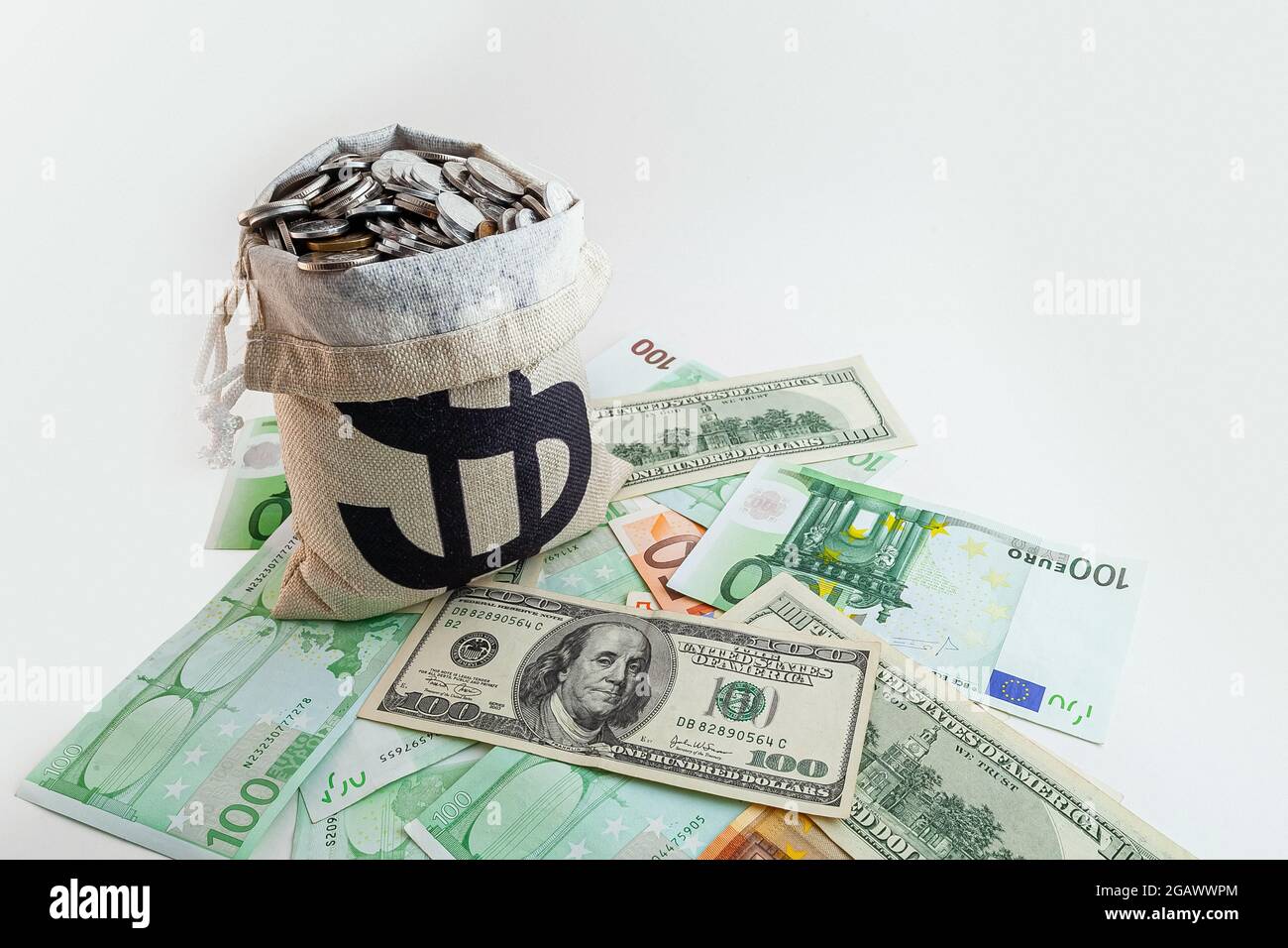 pouch with coins and bitcoins on us dollar and euro banknotes Stock Photo -  Alamy