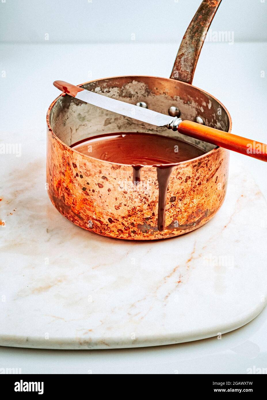 Melting Chocolate in Copper Saucepan Stock Photo