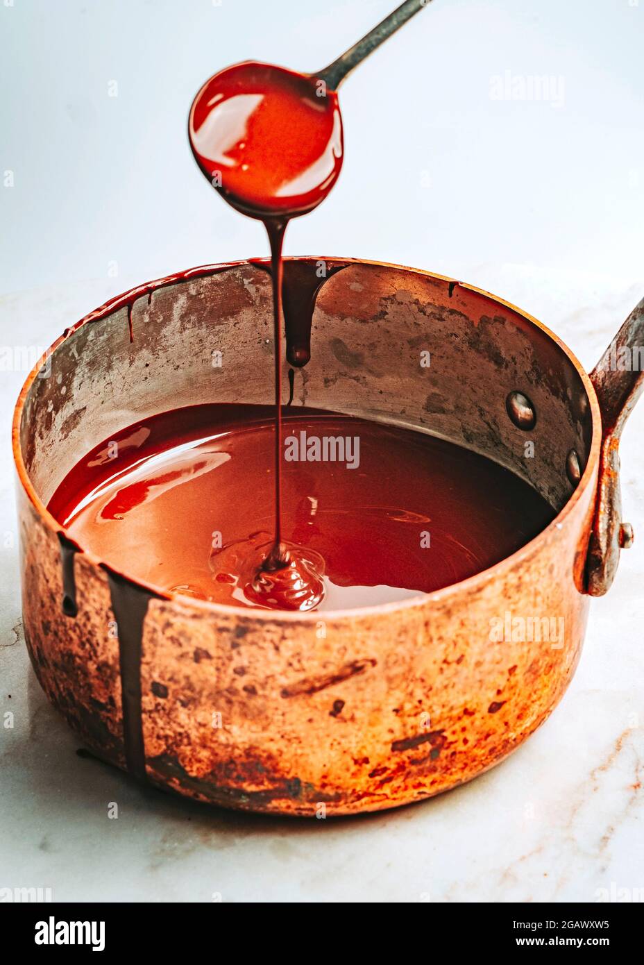 Melting Chocolate in Copper Saucepan Stock Photo