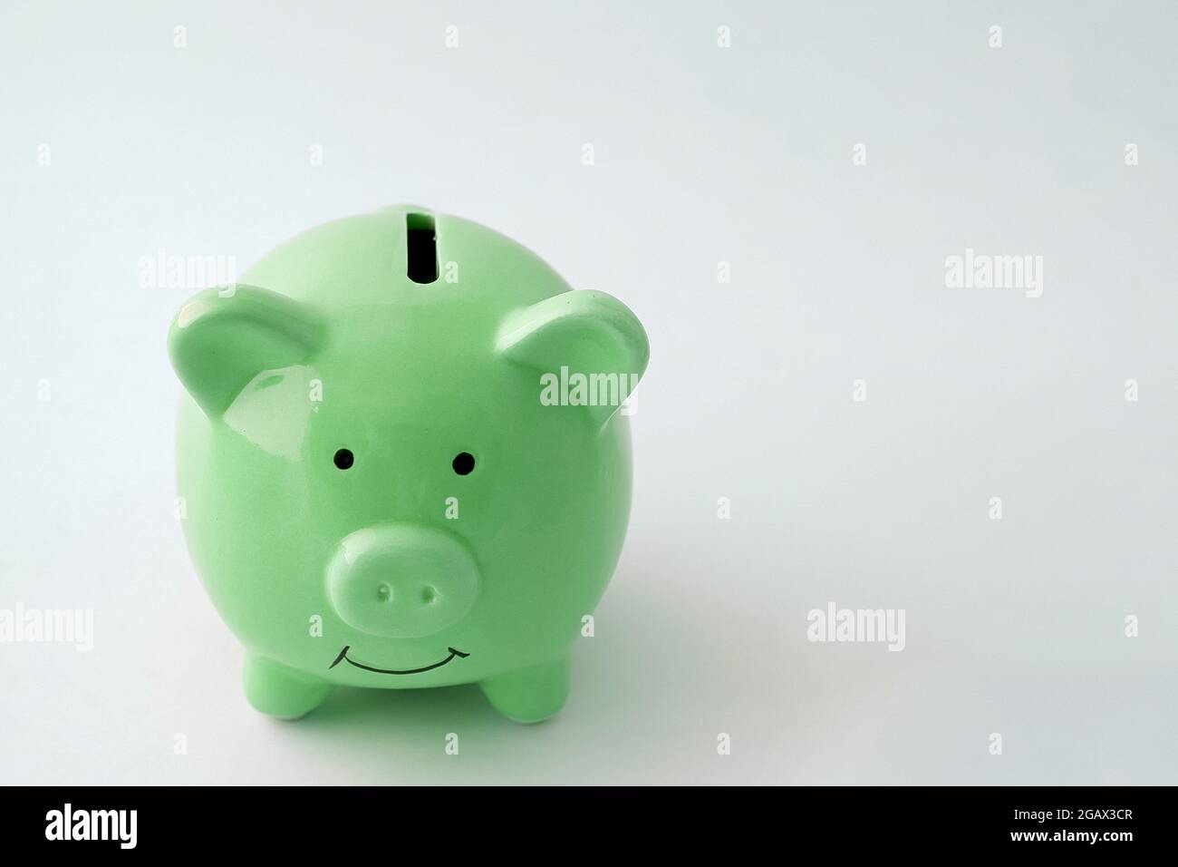Piggy bank in the shape of a pig on an isolated white background Stock