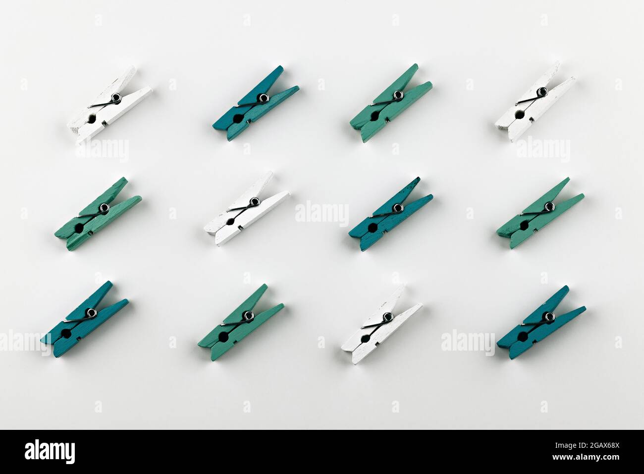 clothes pins pattern on white background. multi-colored clothespins isolated Stock Photo