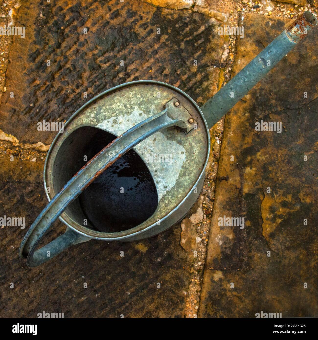 Old Watering Can, viewed from above Stock Photo
