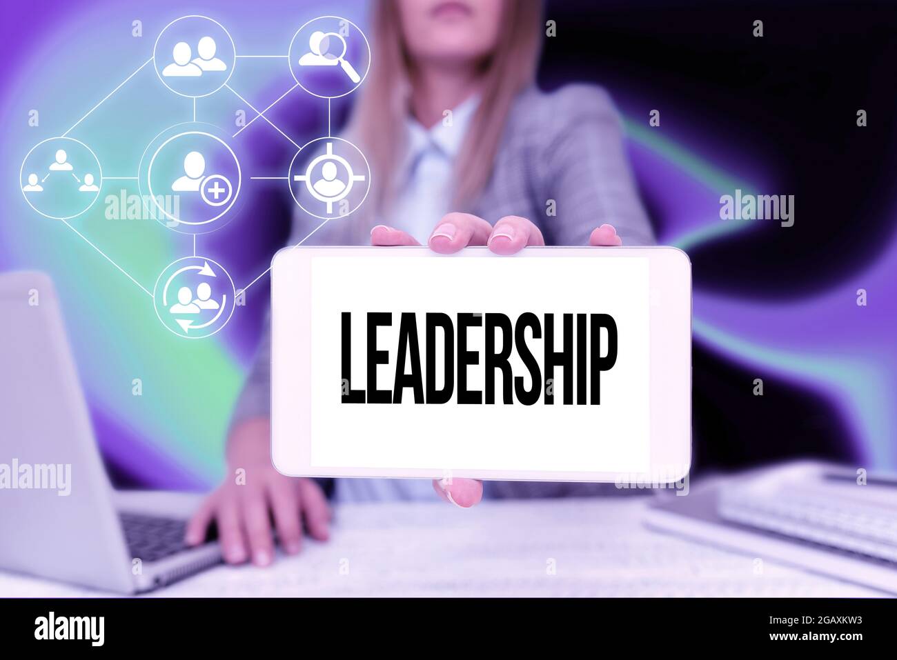 Sign displaying Leadership. Word for art of motivating to act toward achieving a common goal Business Woman Sitting In Office Holding Mobile Stock Photo