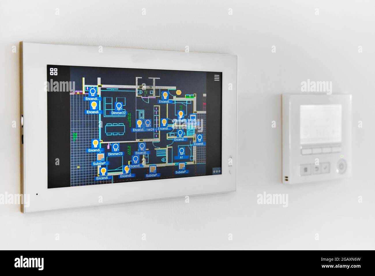 Concept of automation system smart modern luxury wealthy home mounted on white wall close up, no people Stock Photo