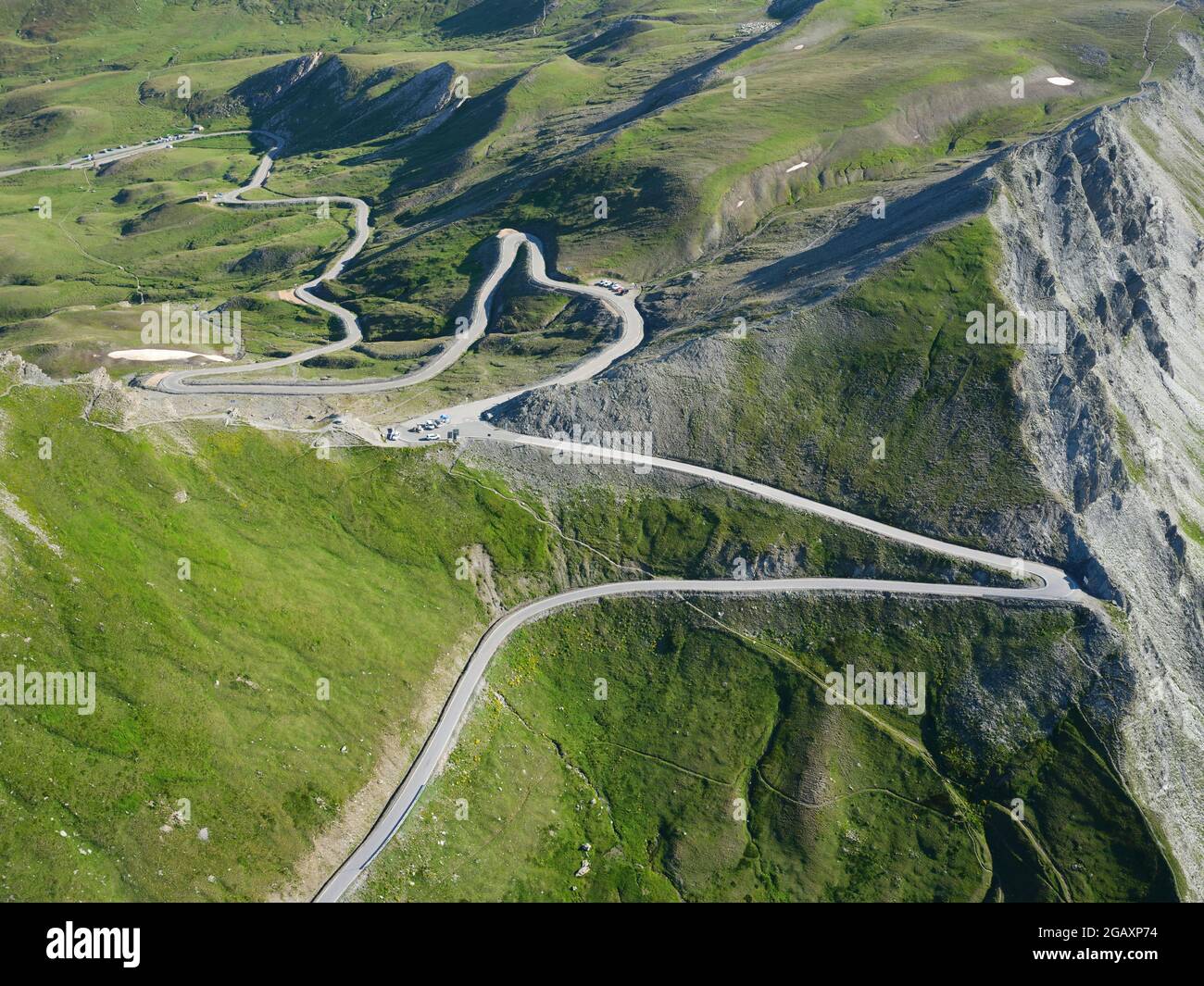 AERIAL VIEW. Agnel Pass separating Italy (foreground) from France, it is one of Europe's highest mountain pass at an altitude of 2744m. Stock Photo