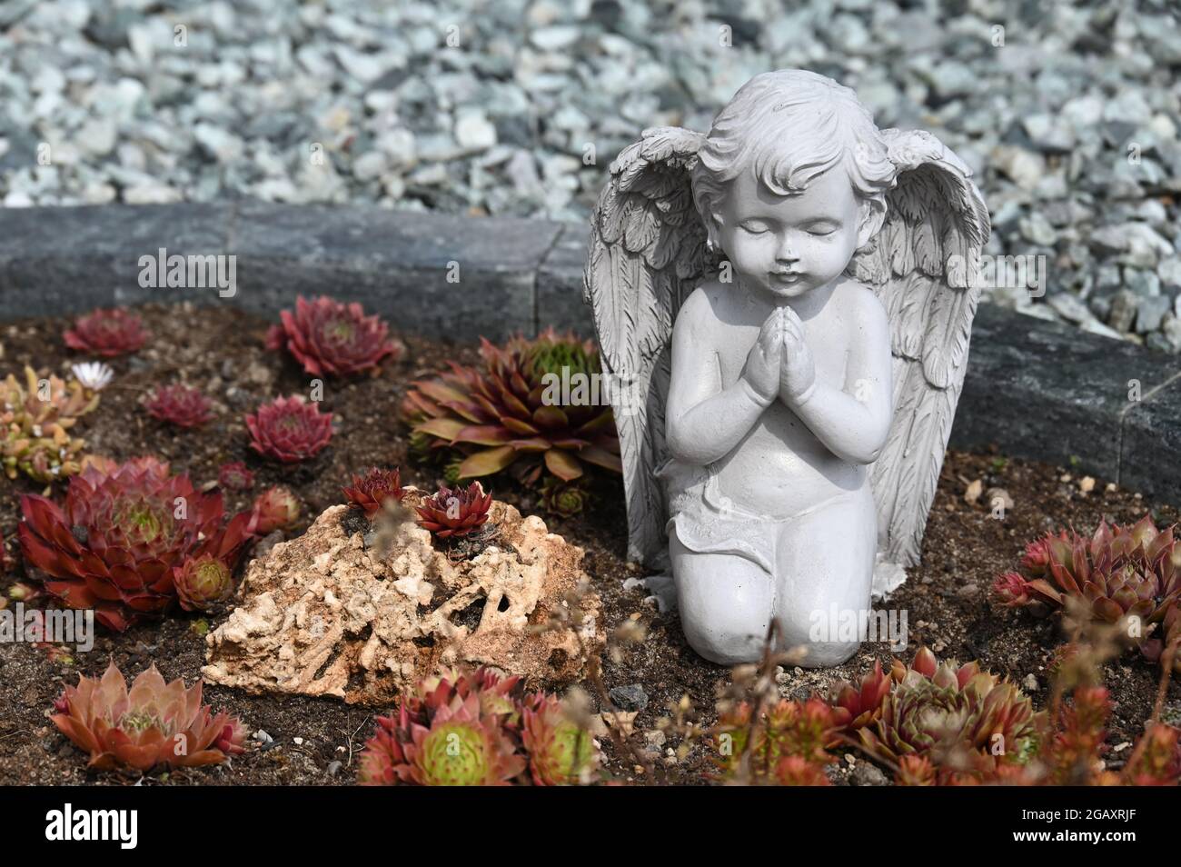 Small angel sculptures as decoration on a grave Stock Photo