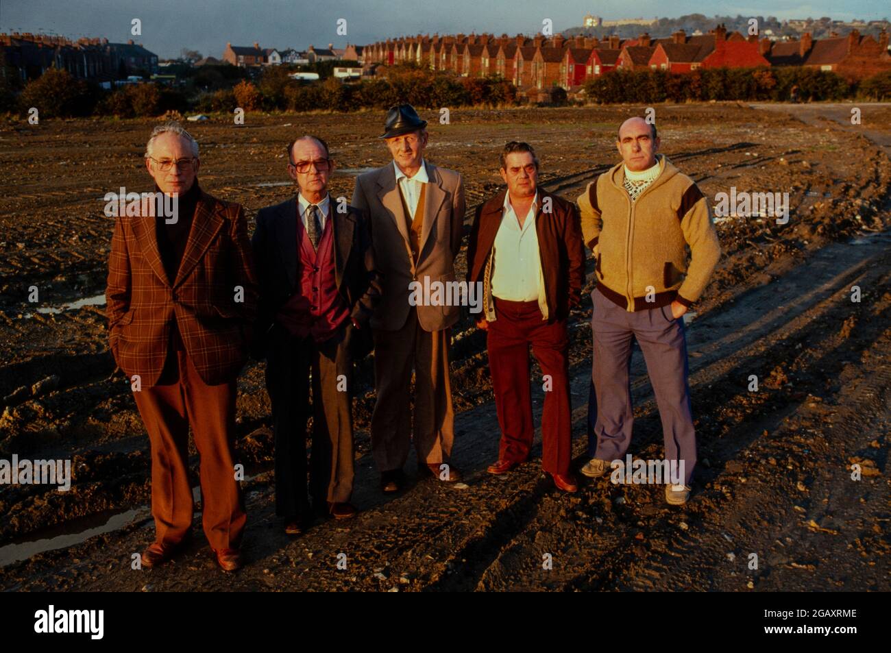 These 5 men worked together at the Coalite plant producing 2.4.5.T until it exploded in 1968.  They are standing at the site where informed obswervers believe the contaminated debris from the explosion is buriede.  The site is being redeveloped for a children's playground. The men  have all had heart attacks, kidney problems and are impotent. The medical problems are consistant with exposure to the Dioxins in 2,4,5-T.  September 1981 Stock Photo