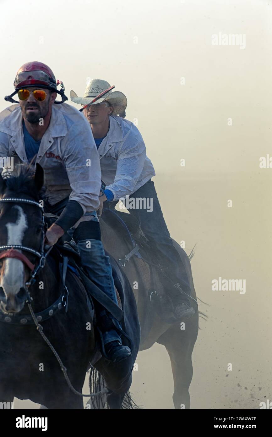 Outriders at the chuckwagon races in Strathmore Alberta Canada Stock Photo