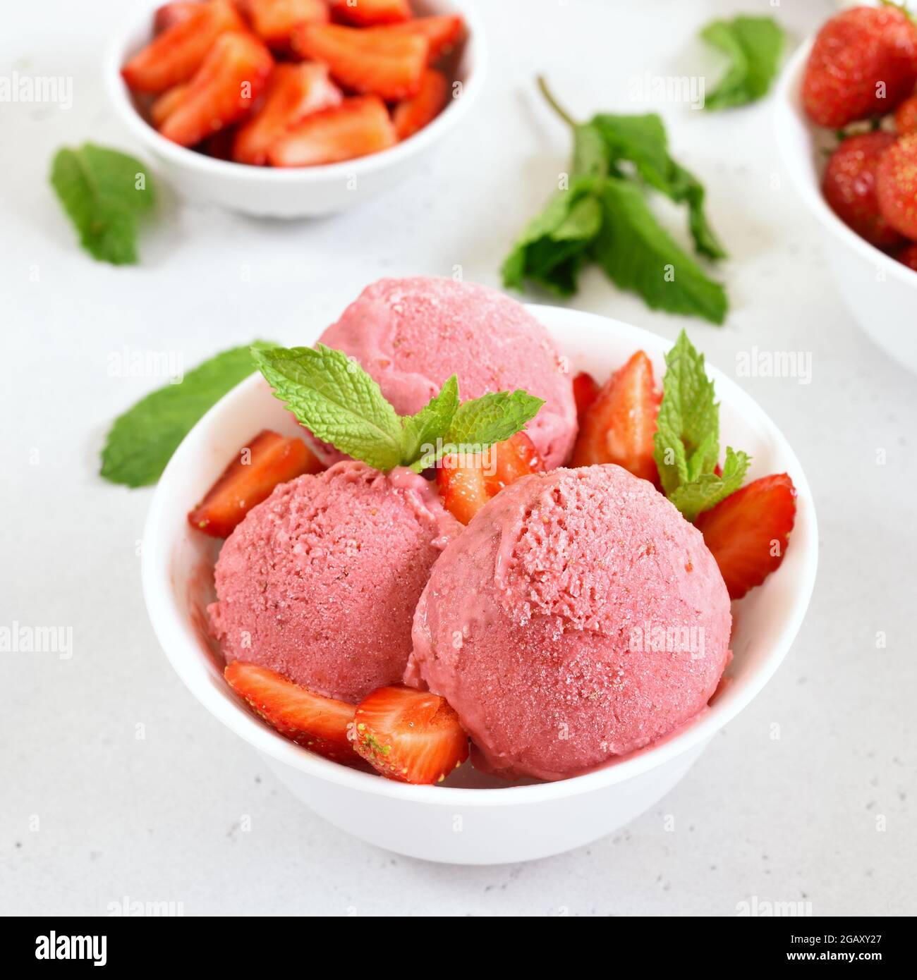 Strawberry ice cream in bowl. Cold summer dessert Stock Photo