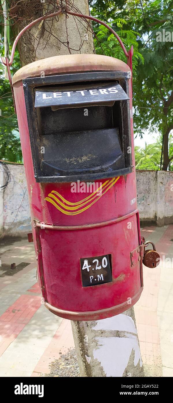 The conventional Indian post box in a blur background of a street village Stock Photo