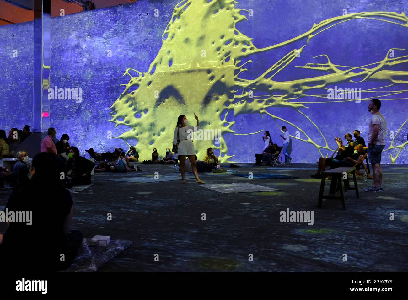Patrons inside the Vincent Van Gogh Immersive Experience in New York City Stock Photo