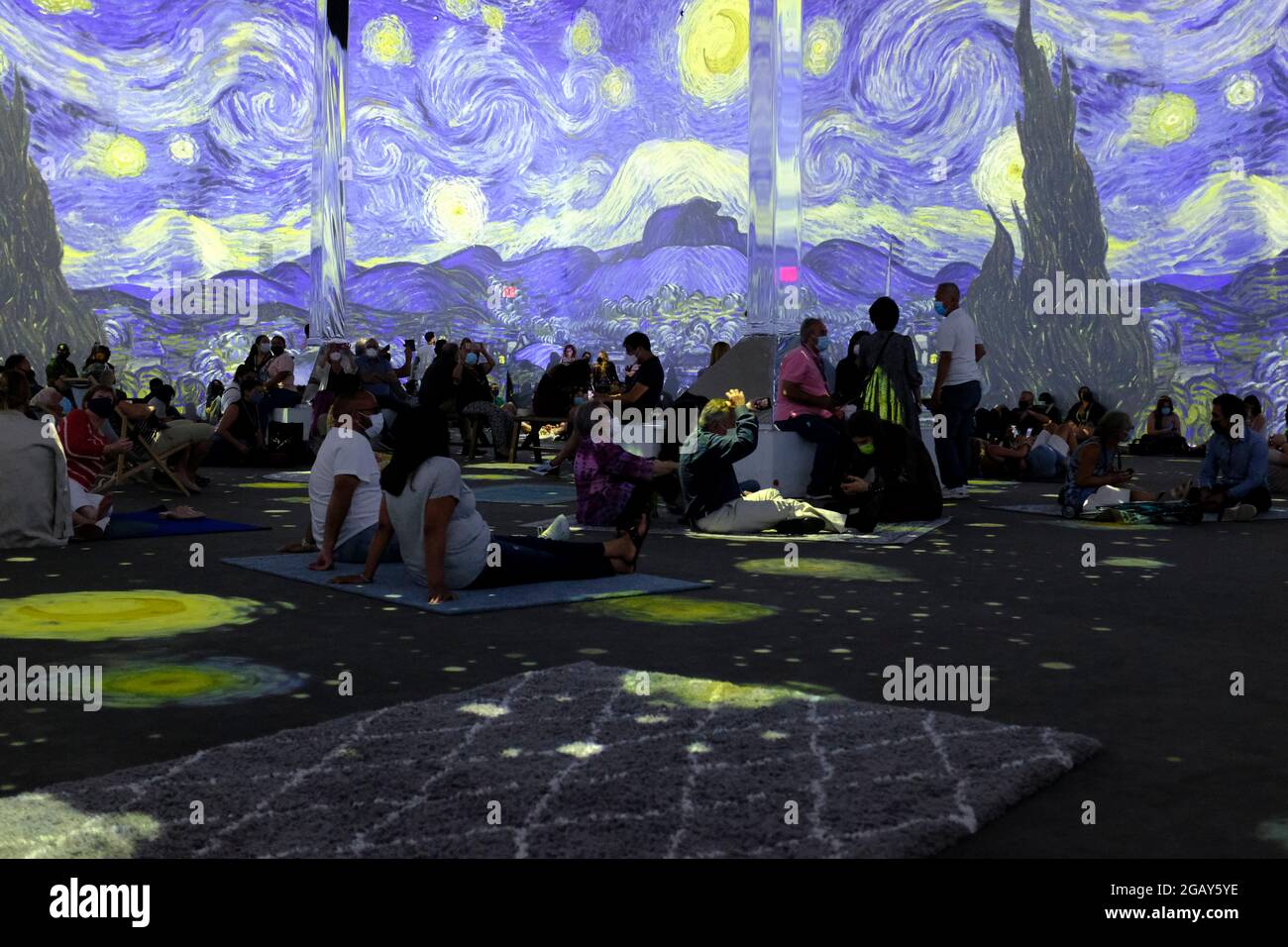 Patrons inside the Vincent Van Gogh Immersive Experience in New York City Stock Photo