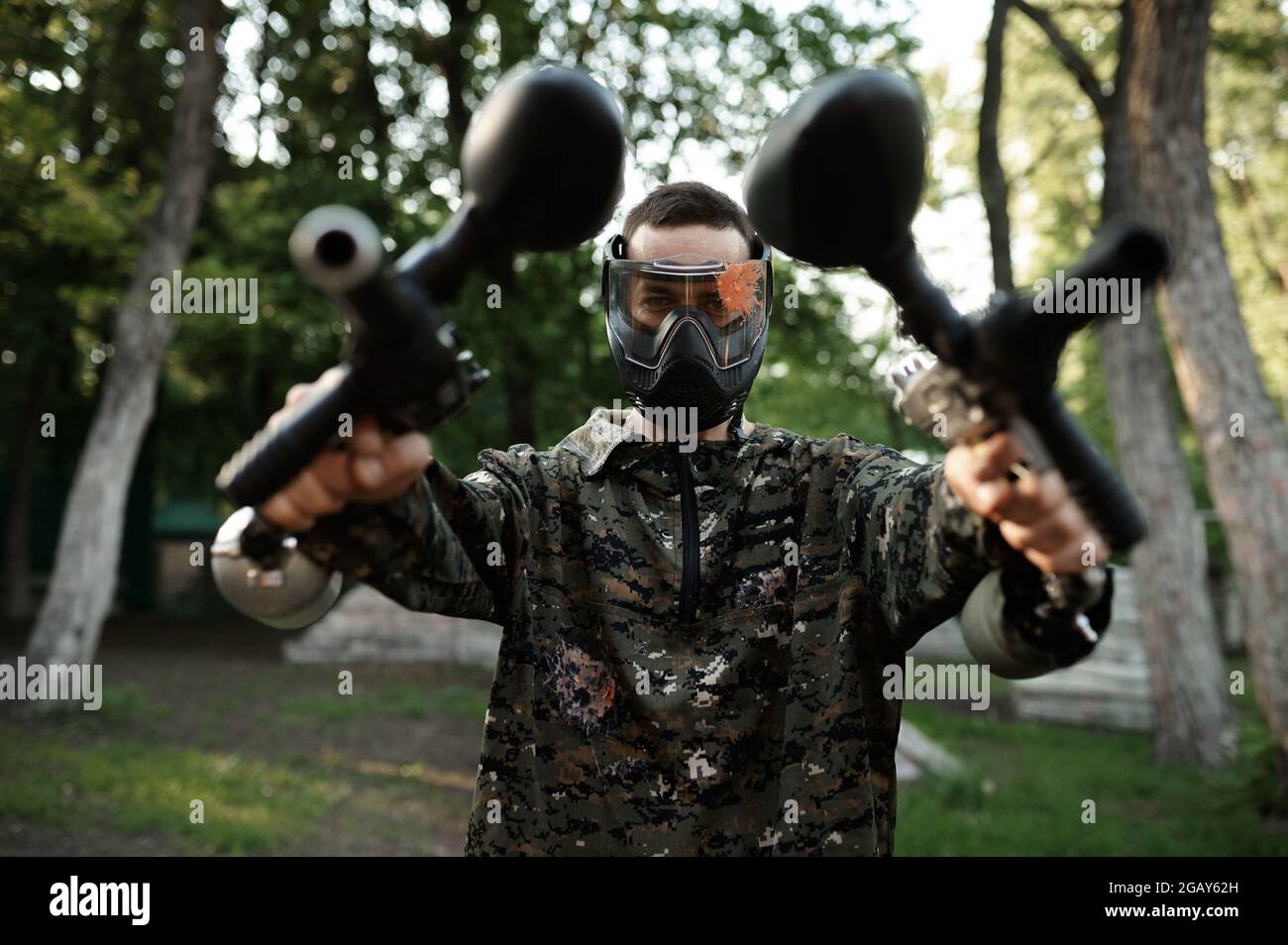 Paintball warrior poses on playground in forest Stock Photo Alamy