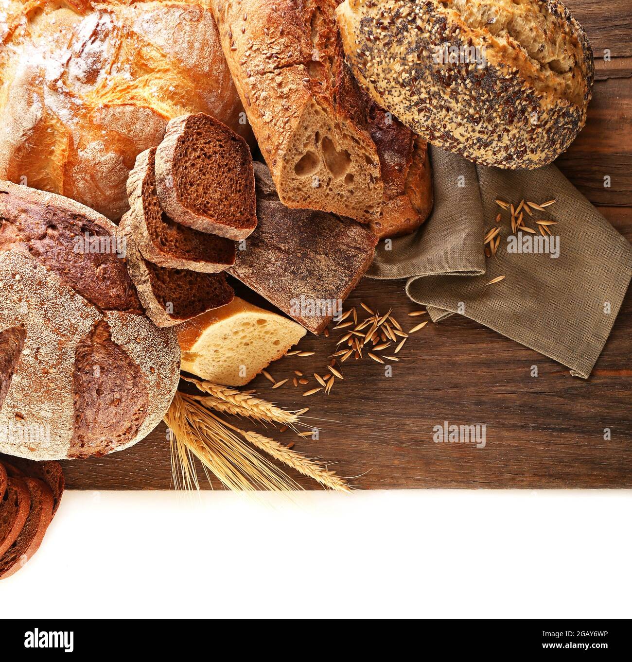 Fresh baked bread and wheat ears, isolated on white Stock Photo - Alamy