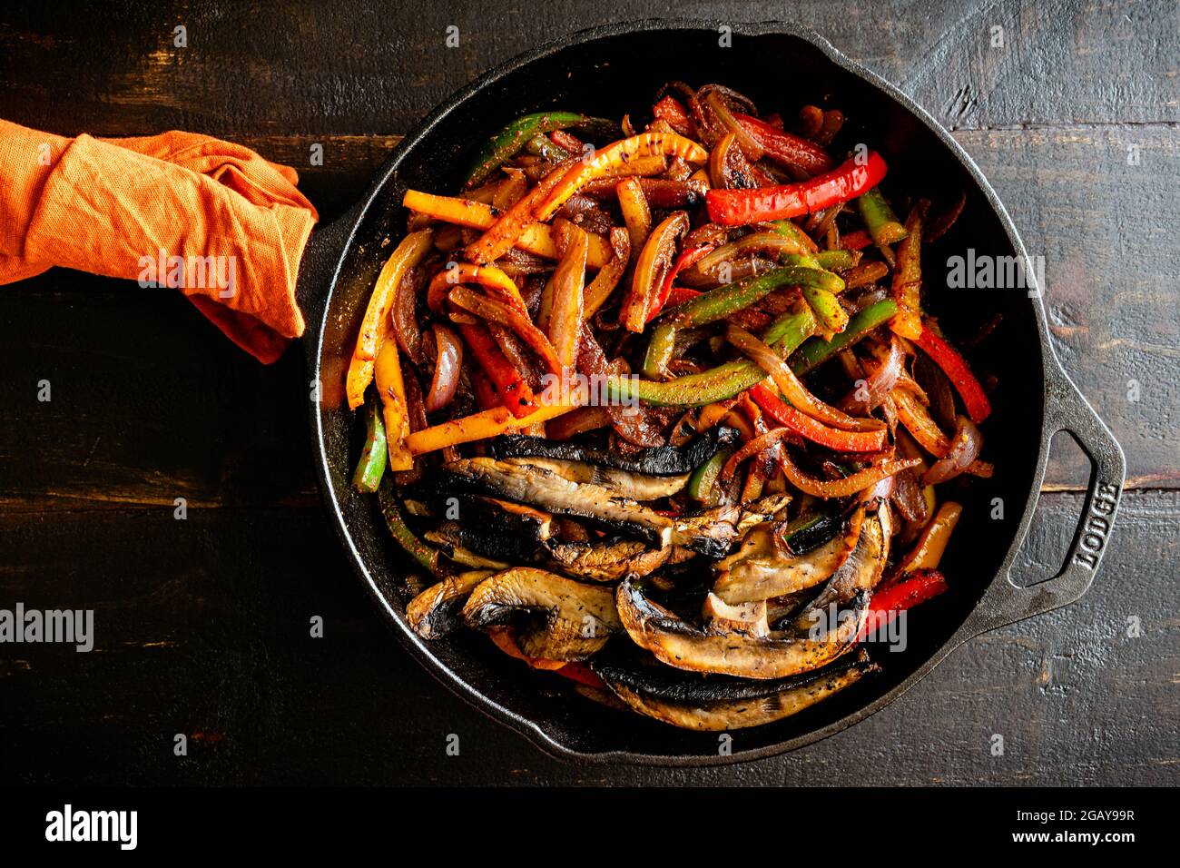 Vegan Fajita Filling in a Cast Iron Skillet Charred bell peppers, red onion, and portobello