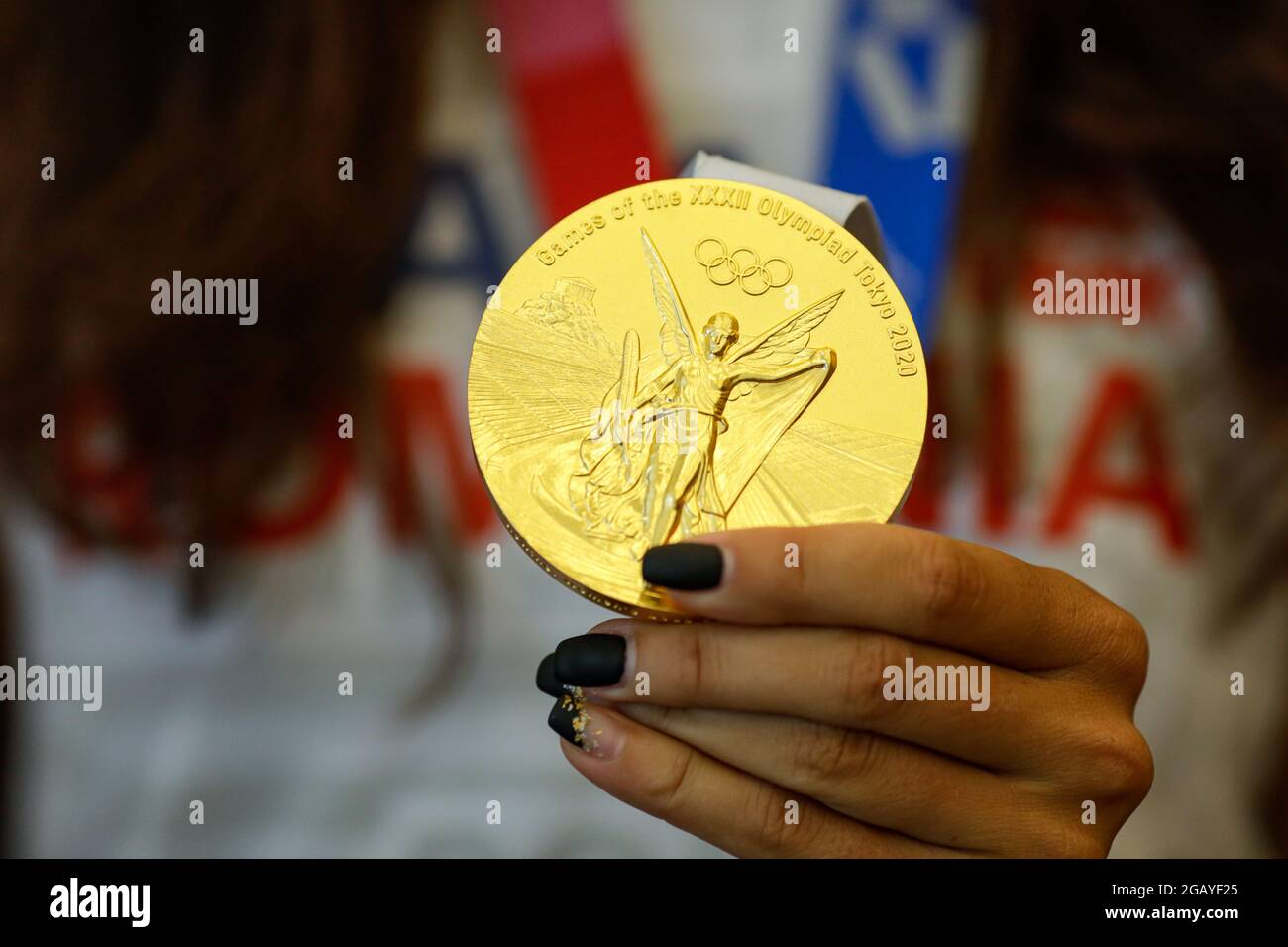 Otopeni, Romania - August 1, 2021: Details with a Tokyo 2020 Olympic Games gold medal won by a Romanian female athlete. Stock Photo