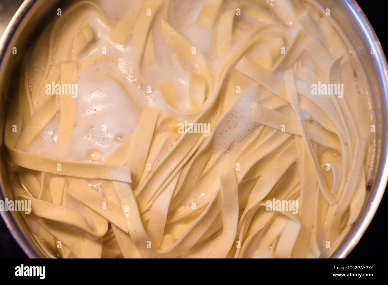 Overhead photo of boiling noodles or pasta in pot Stock Photo Alamy