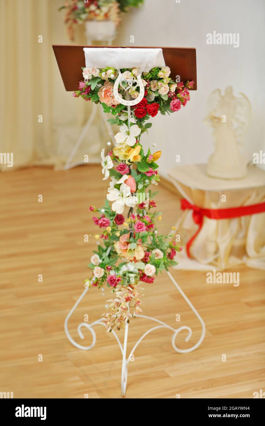 Wedding desk decorated with garland of flowers Stock Photo Alamy