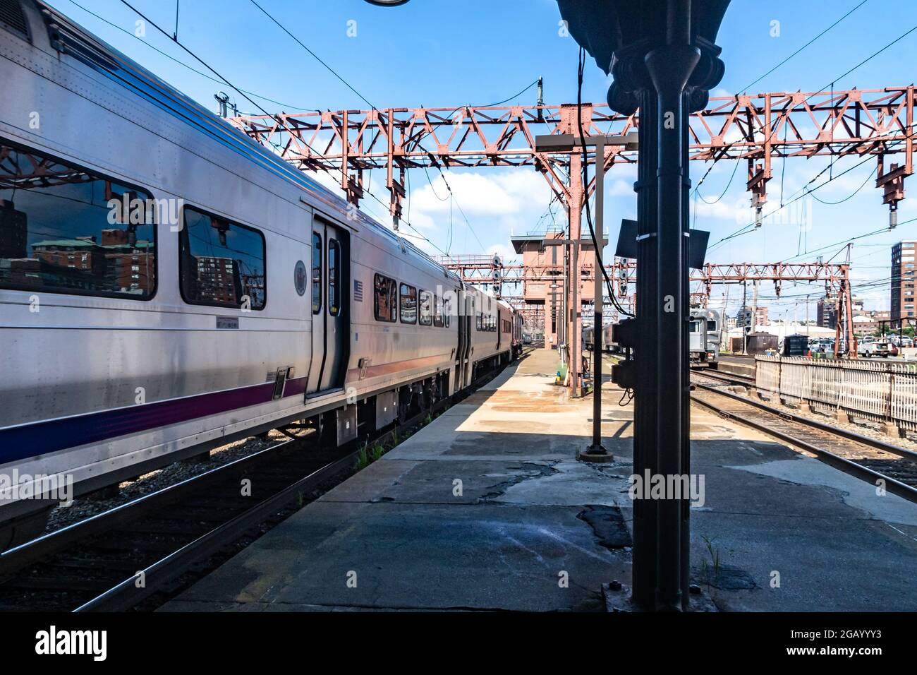 Hoboken, NJ - USA - July 30, 2021:  Horizontal view of a New Jersey Transit Train pullling out of the historic Hoboken Terminal. Stock Photo