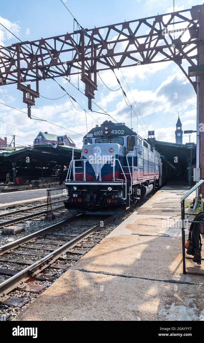 Hoboken, NJ - USA - July 30, 2021:  Vertical view of a New Jersey Transit Train pullling out of the historic Hoboken Terminal. Stock Photo