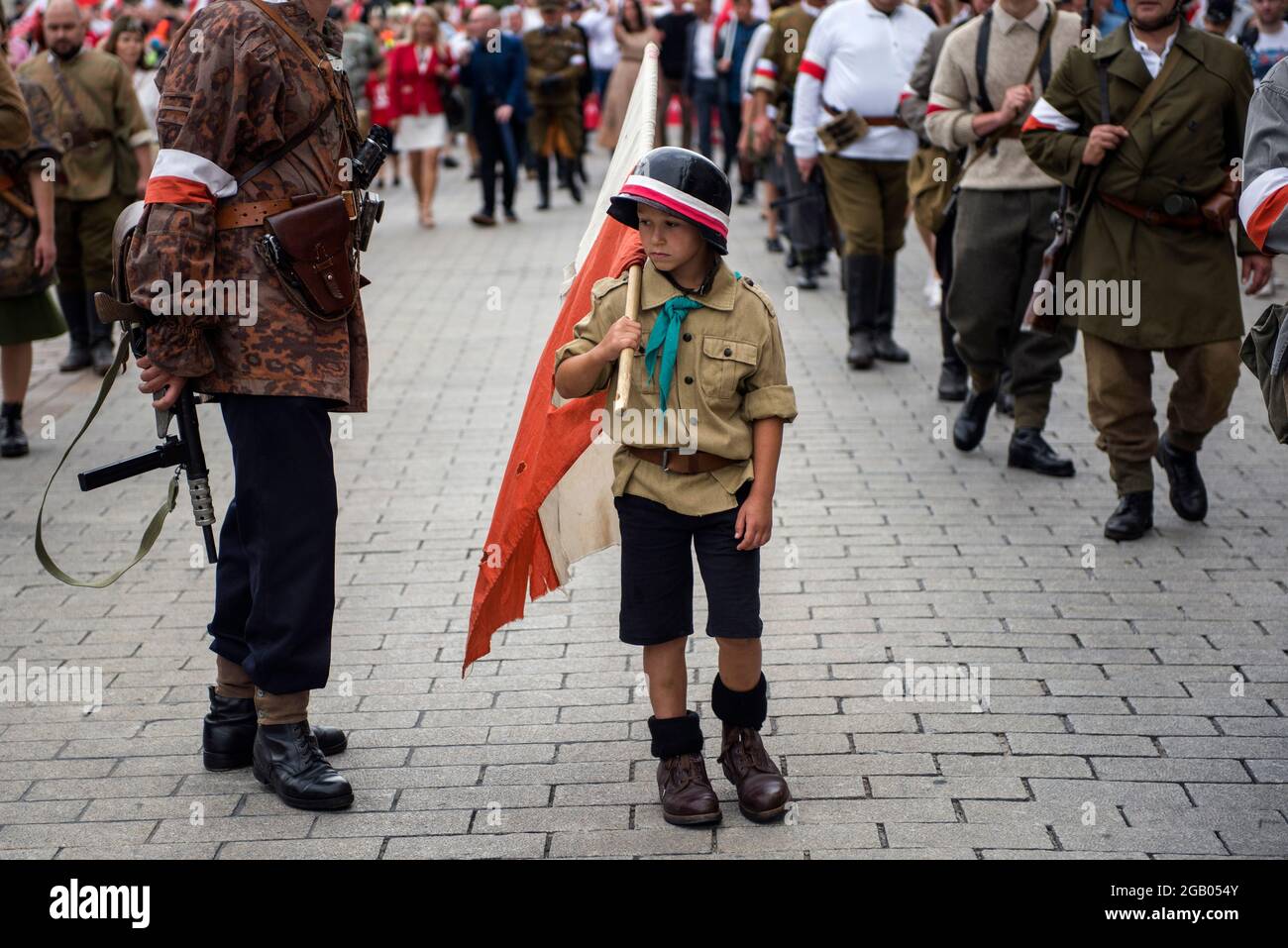 Warsaw, Poland. 01st Aug, 2021. A little boy is dressed up as insurgent during the march.Thousands of people took part in a march organised by the National Radical Camp (ONR) and other nationalist organizations to commemorate the 77th anniversary of the Warsaw Uprising (Powstanie Warszawskie). Credit: SOPA Images Limited/Alamy Live News Stock Photo