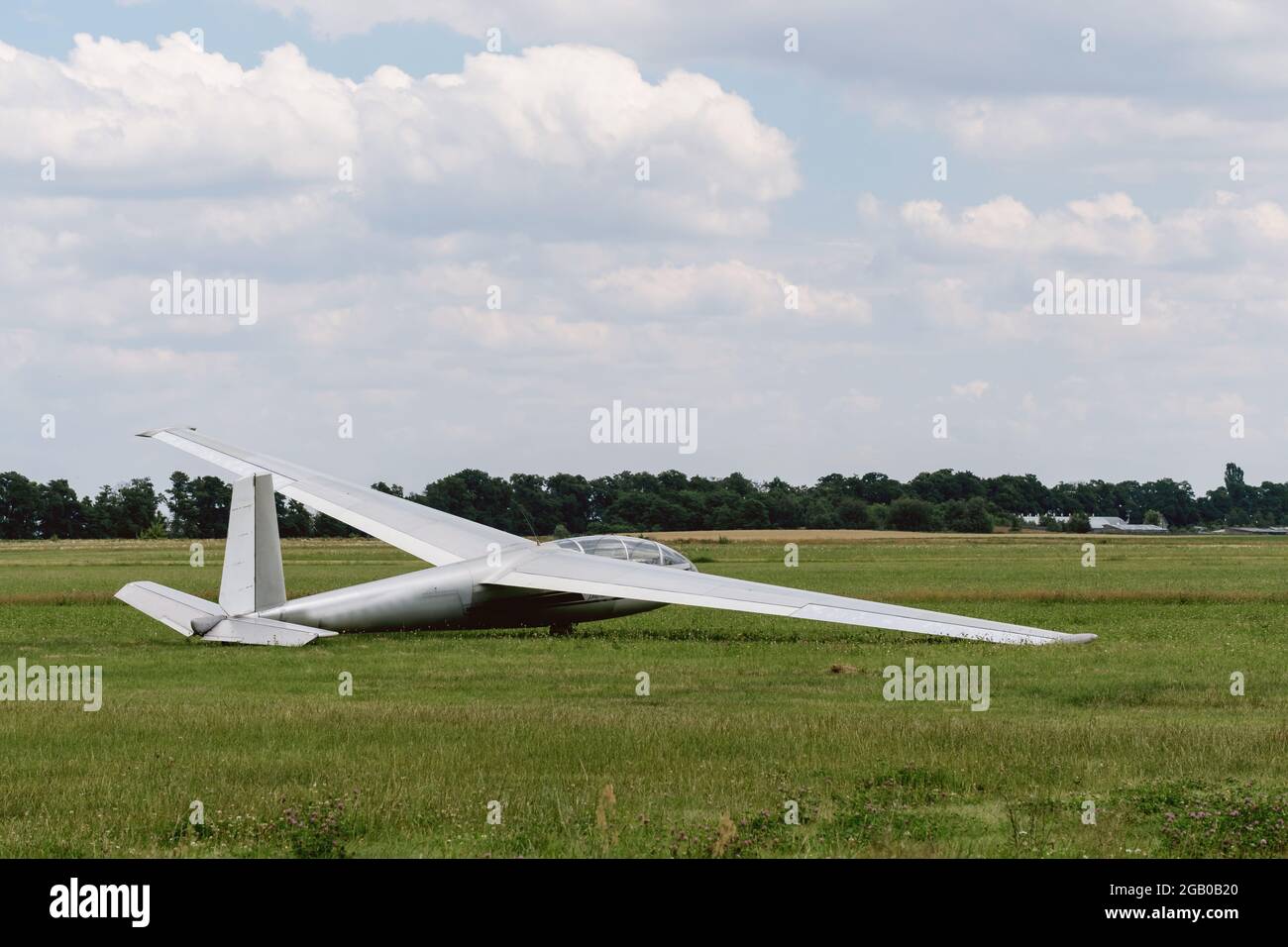 Single glider on the airfield waiting to go into the air. Aircraft for active extreme sport. Stock Photo