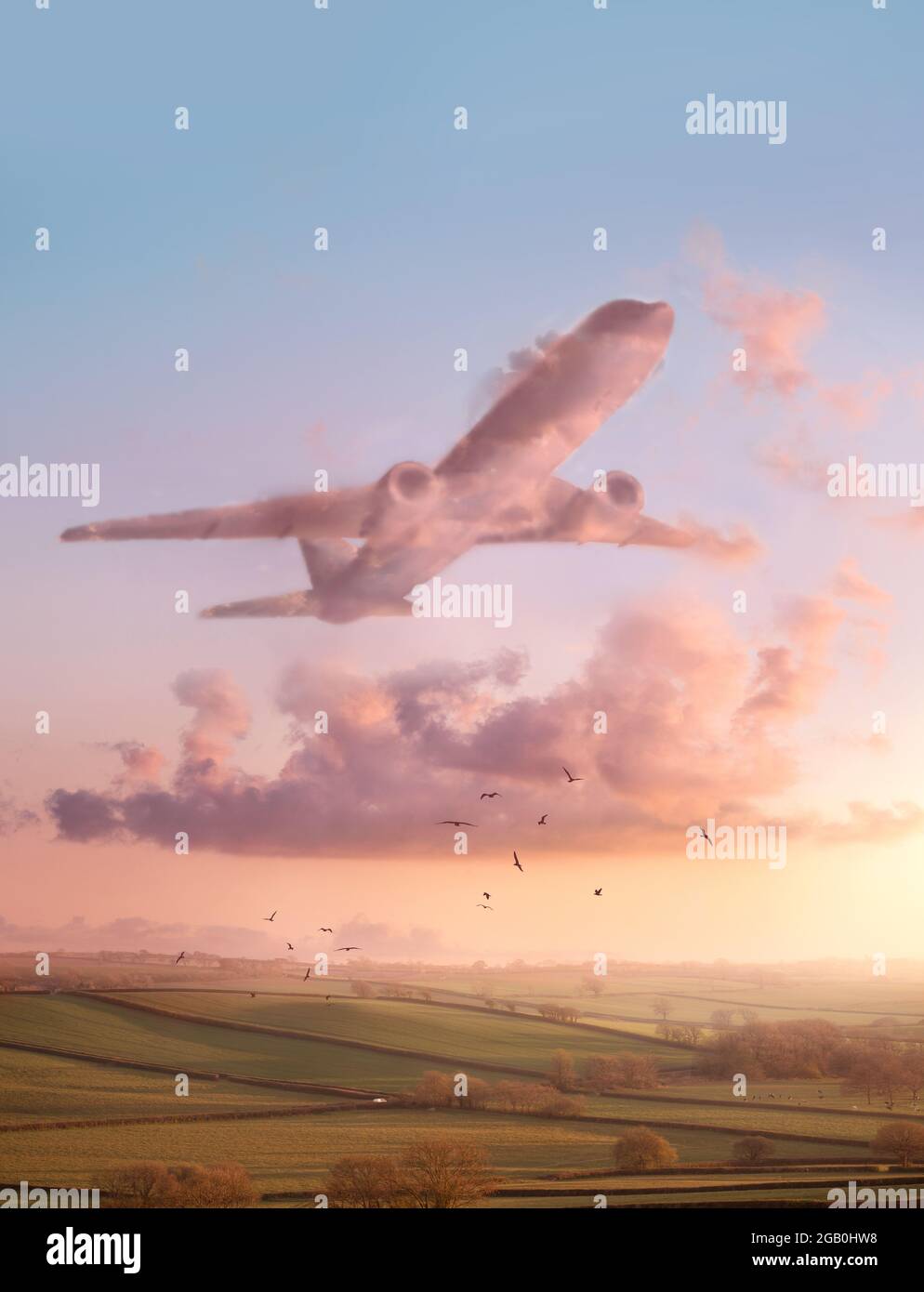 A sunset landscape scene with pink fluffy clouds in the shape of an airplane. Travel and flight conceptual Illustration. Stock Photo