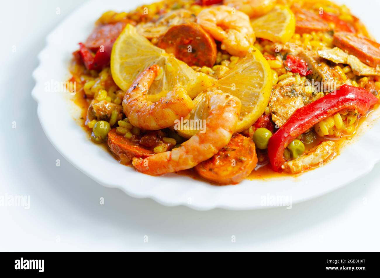 Delicious paella, cooked risotto rice with chicken thigh, king prawns