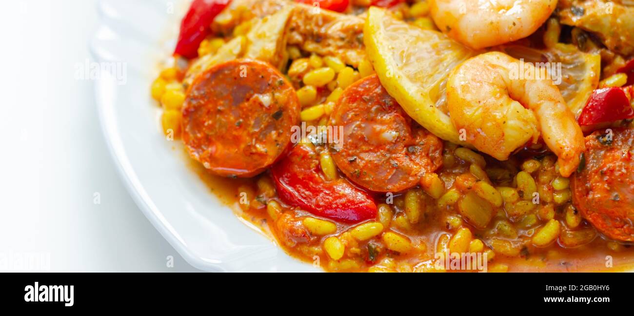 Delicious paella, cooked risotto rice with chicken thigh, king prawns