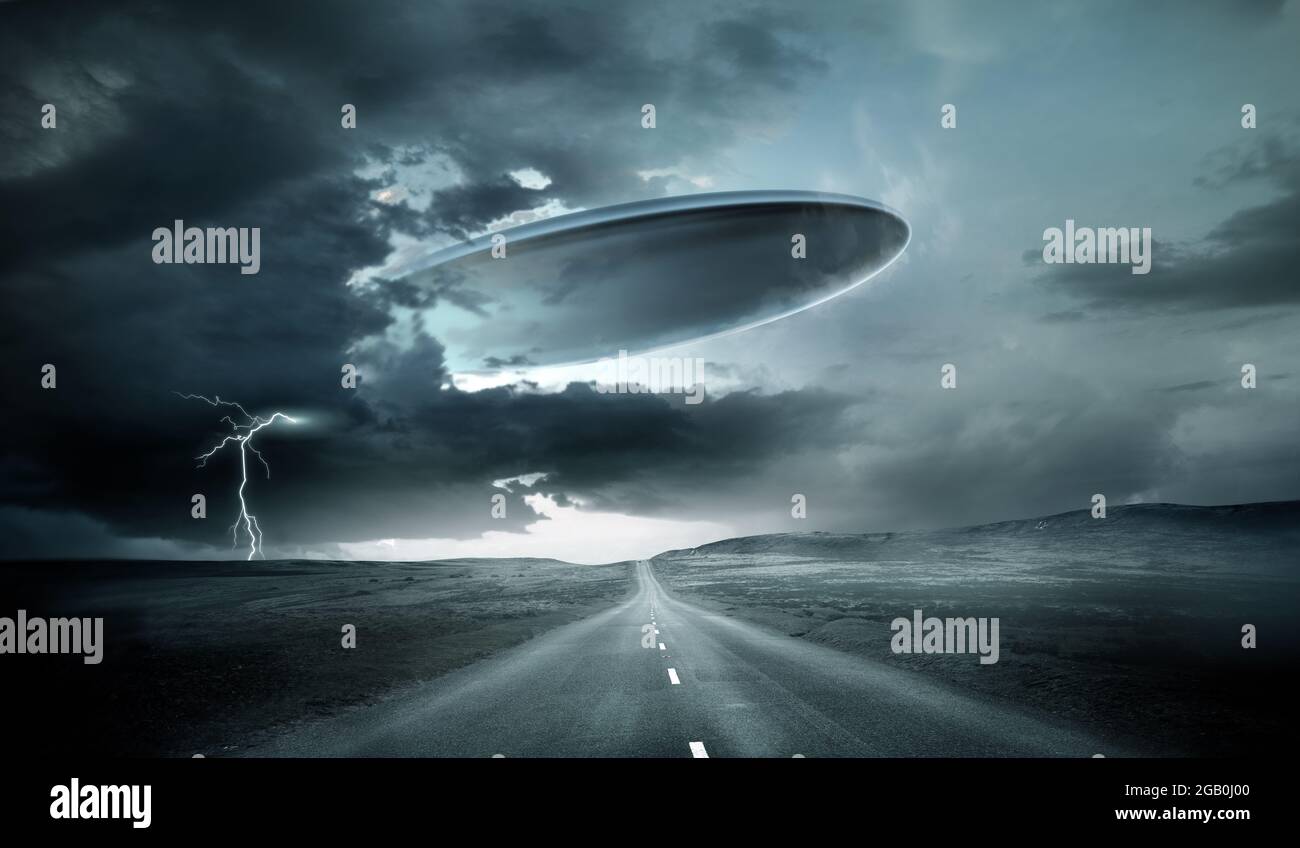 A large alien spaceship emerging from storm clouds on earth. 3D illustration. Stock Photo