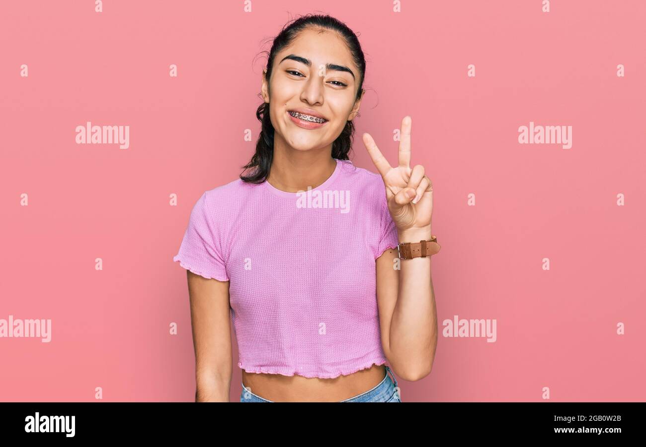 Positive teenager girl hand sign hi-res stock photography and images ...