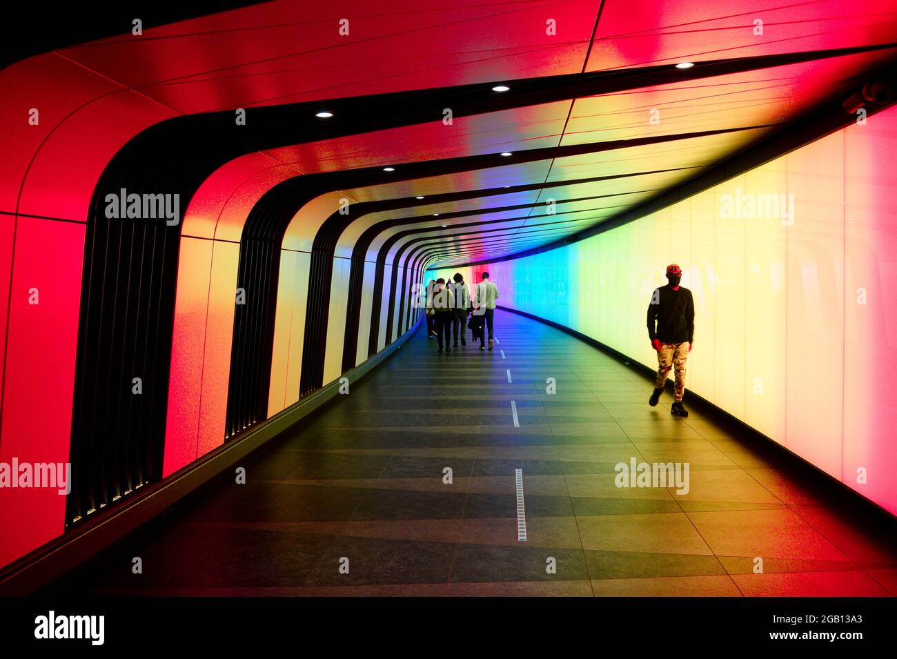 Kings Cross light tunnel with commuters Stock Photo Alamy