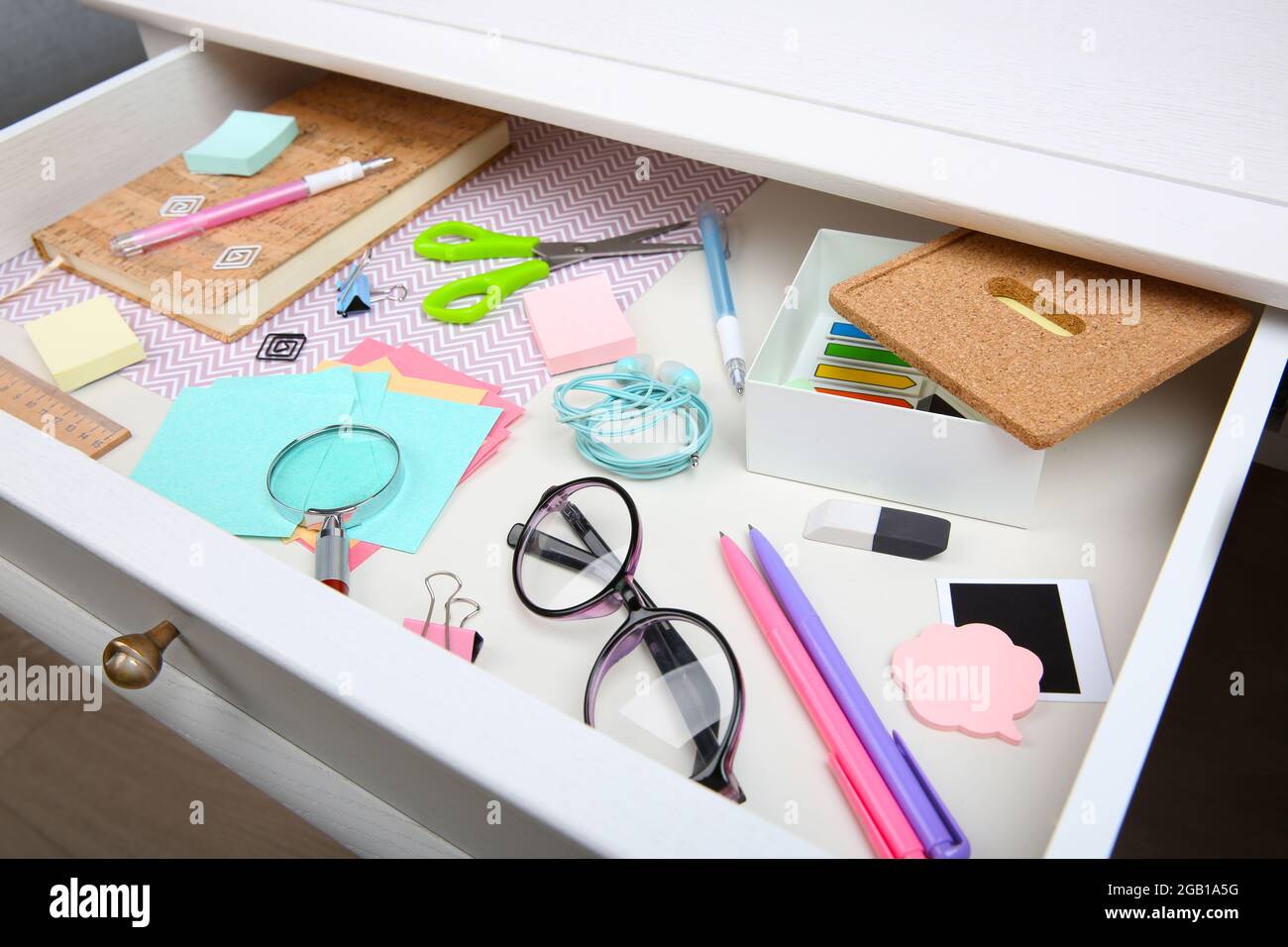 Stationery in open desk drawer closeup Stock Photo