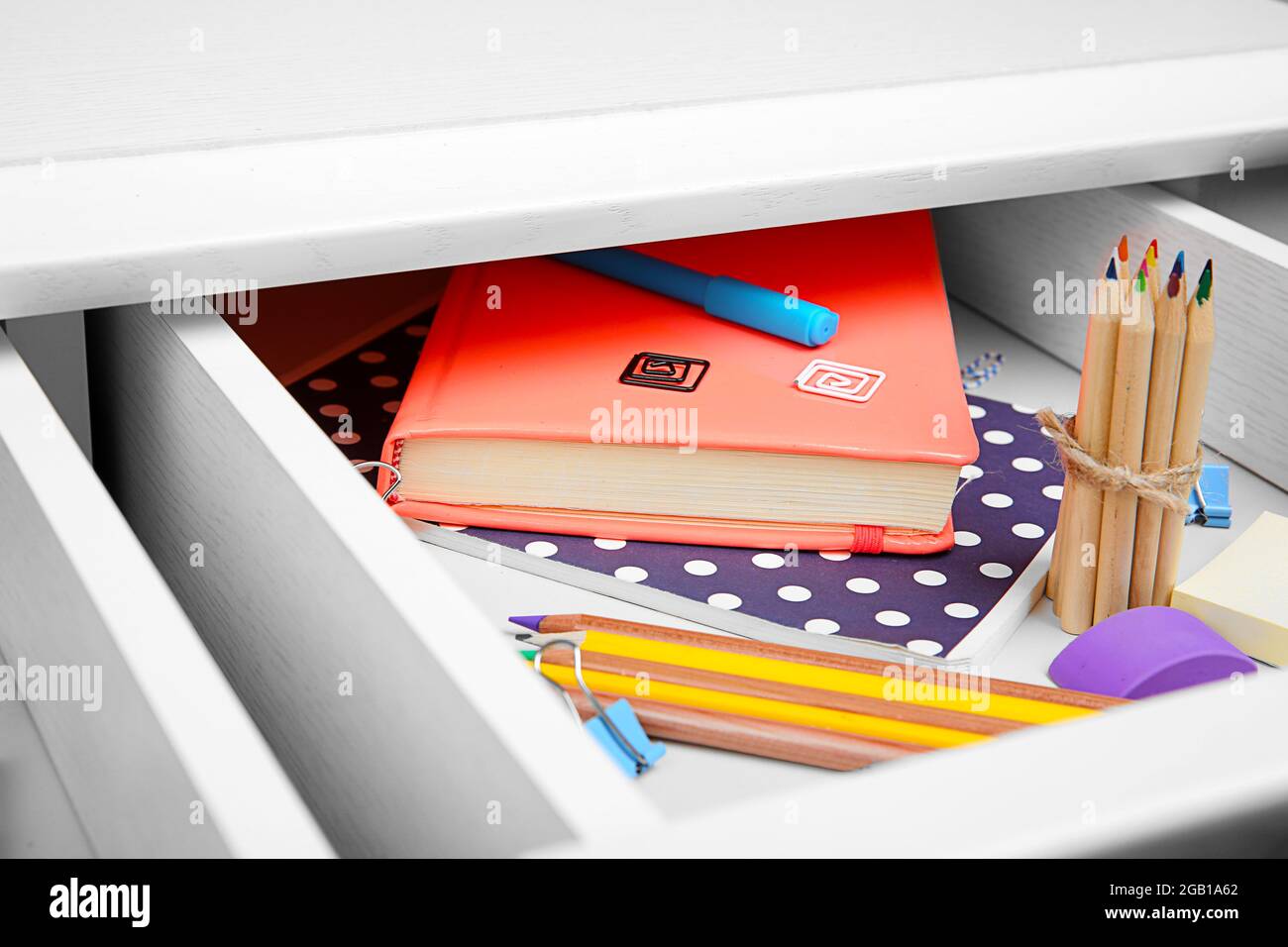 Stationery in open desk drawer closeup Stock Photo Alamy