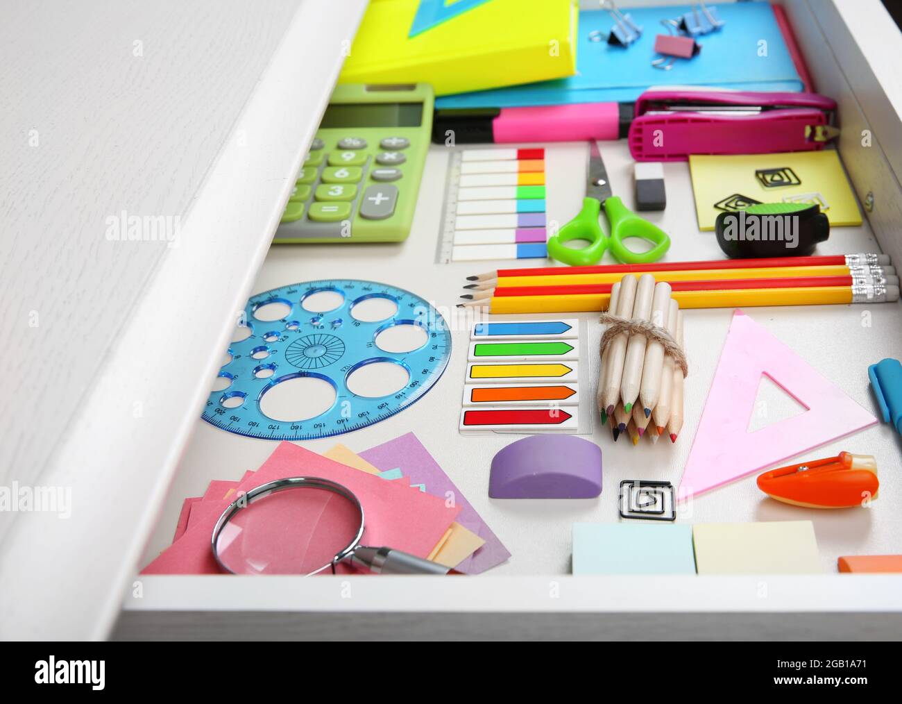 Stationery in open desk drawer closeup Stock Photo Alamy