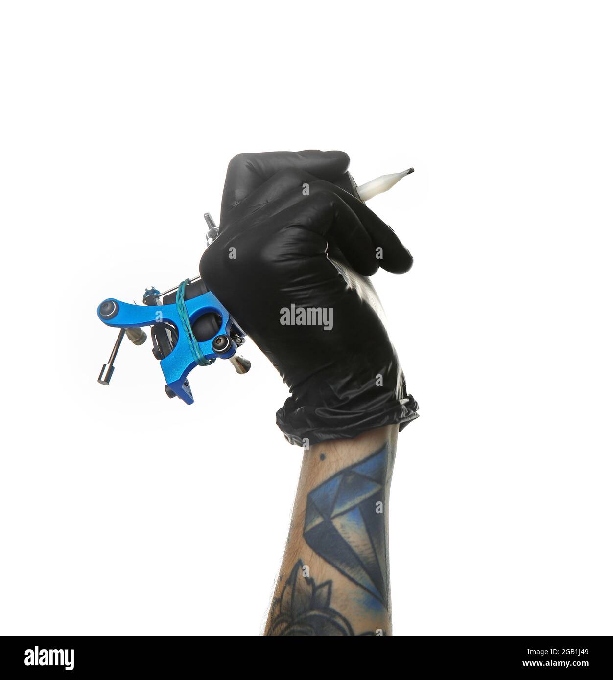Man's hand holding tattoo machine on white background Stock Photo Alamy