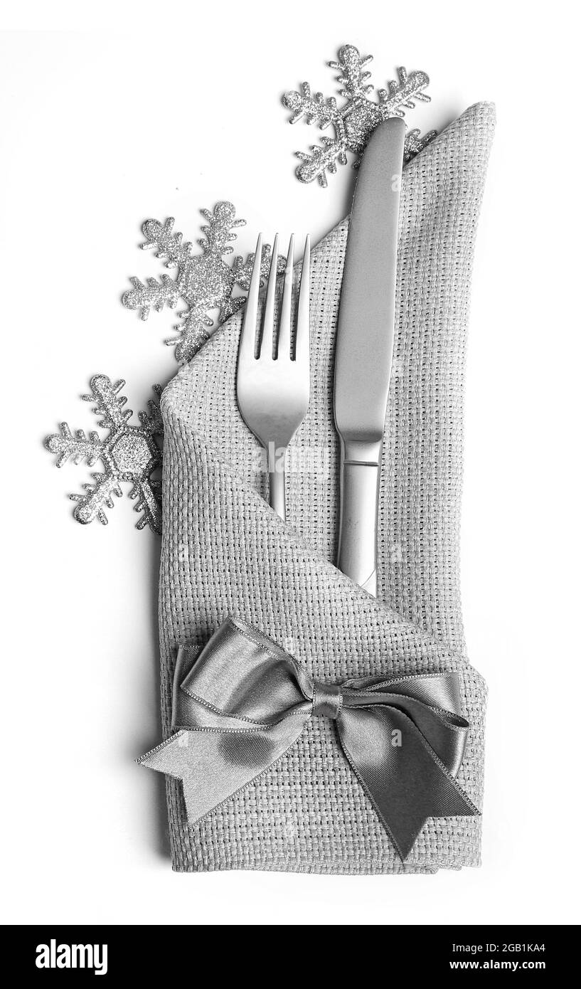 Christmas serving cutlery in a napkin, isolated on white Stock Photo