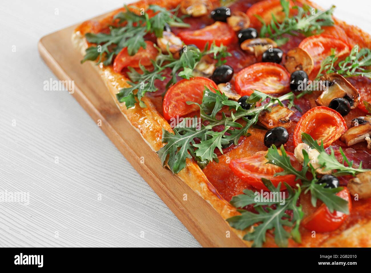 Part of rectangle delicious pizza, isolated on white Stock Photo - Alamy