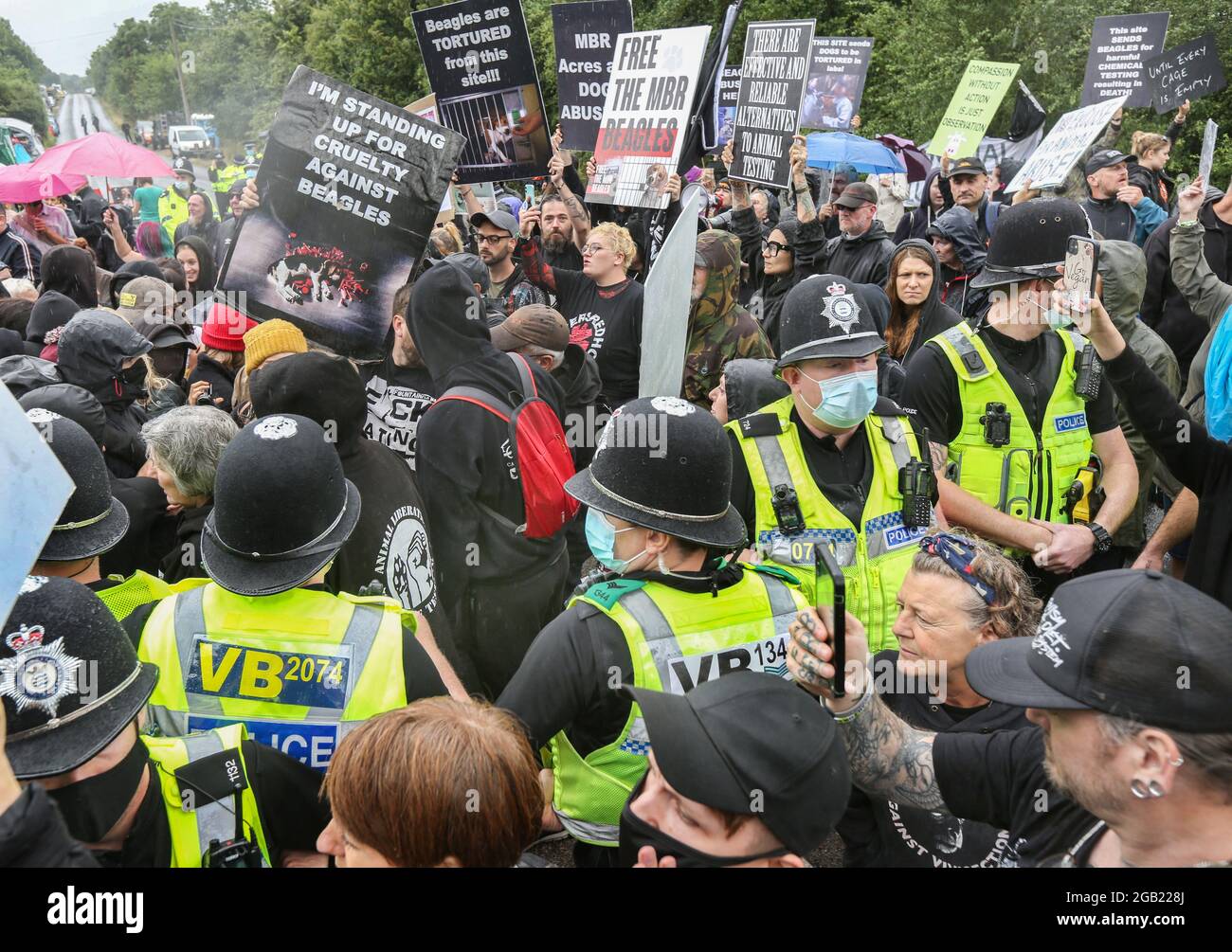 Protesters hold placards during the demonstration. Protesters from all ...