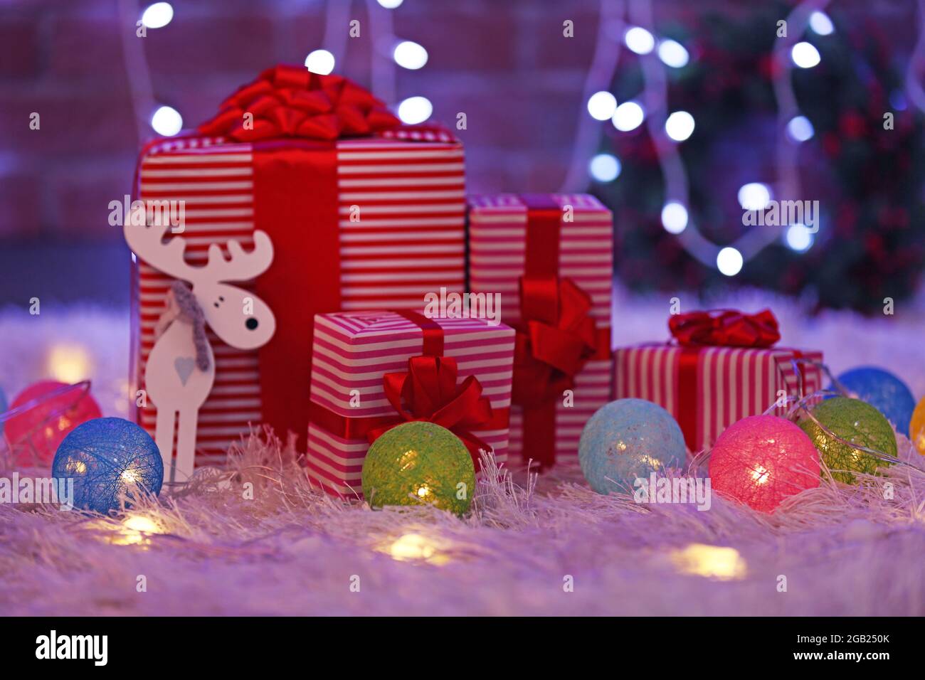 Christmas gift boxes and lights on the floor Stock Photo Alamy