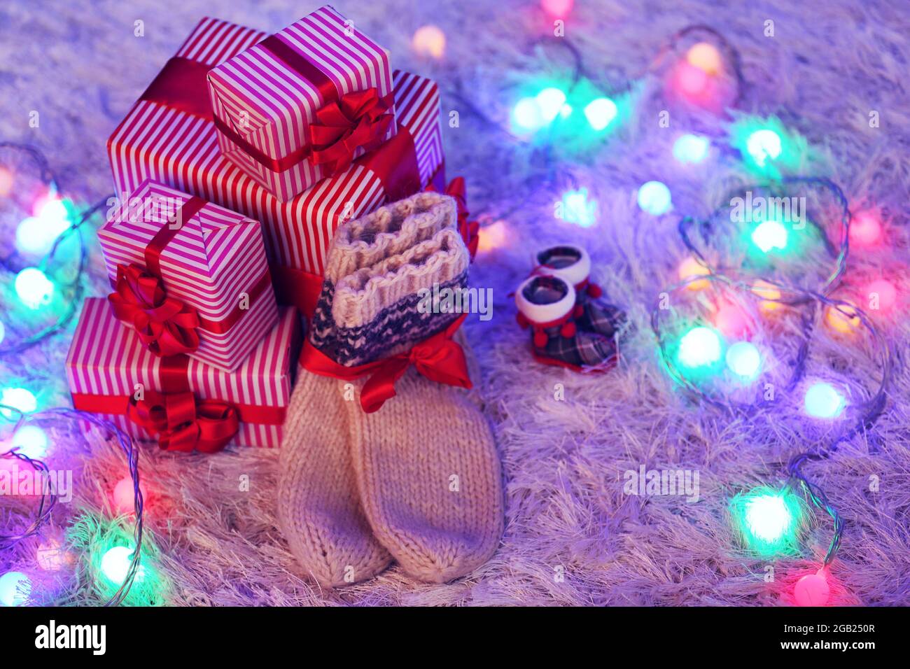 Christmas gift boxes and lights on the floor Stock Photo Alamy
