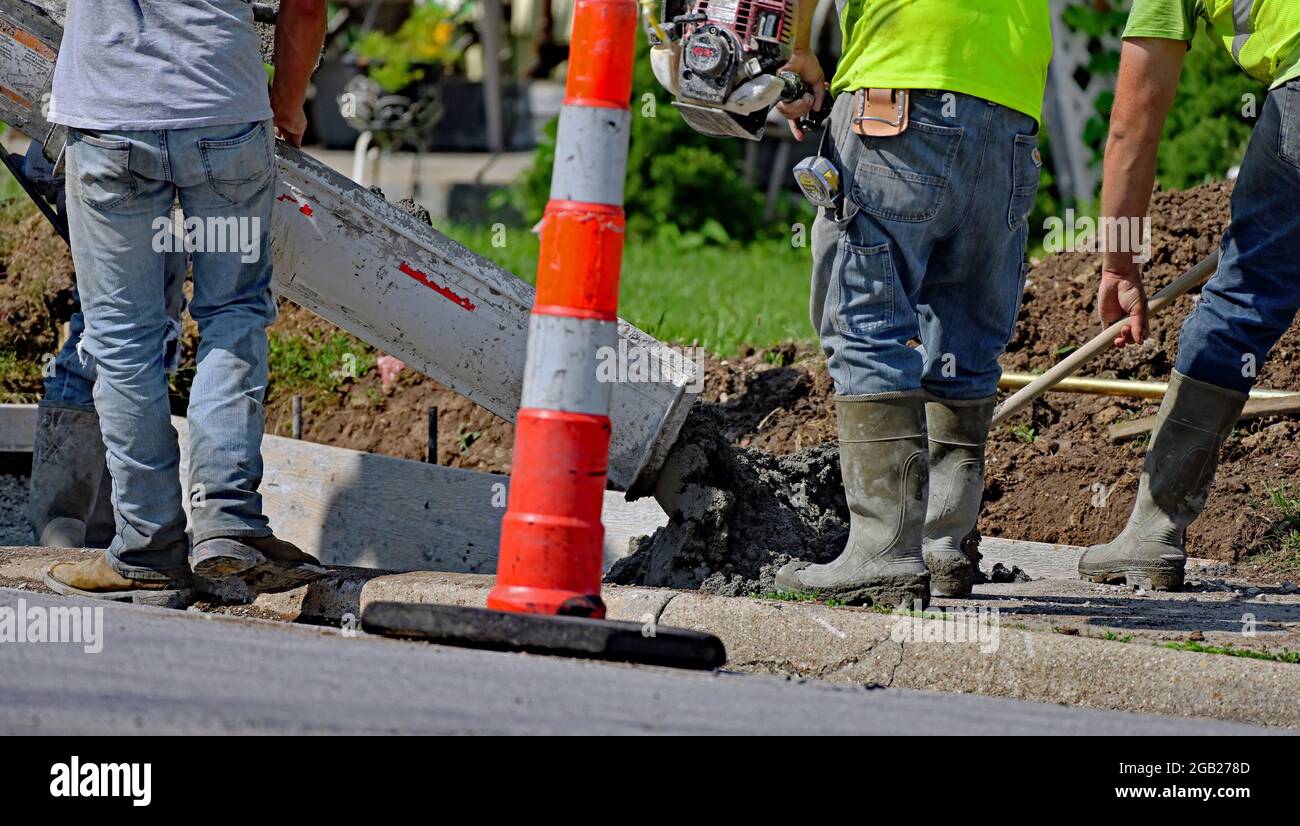 Concrete contractors working for the City of Emporia pour new concrete