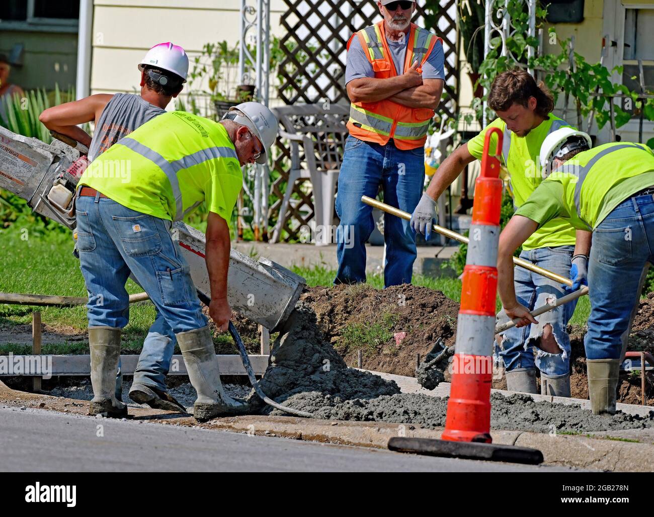 Concrete contractors working for the City of Emporia pour new concrete