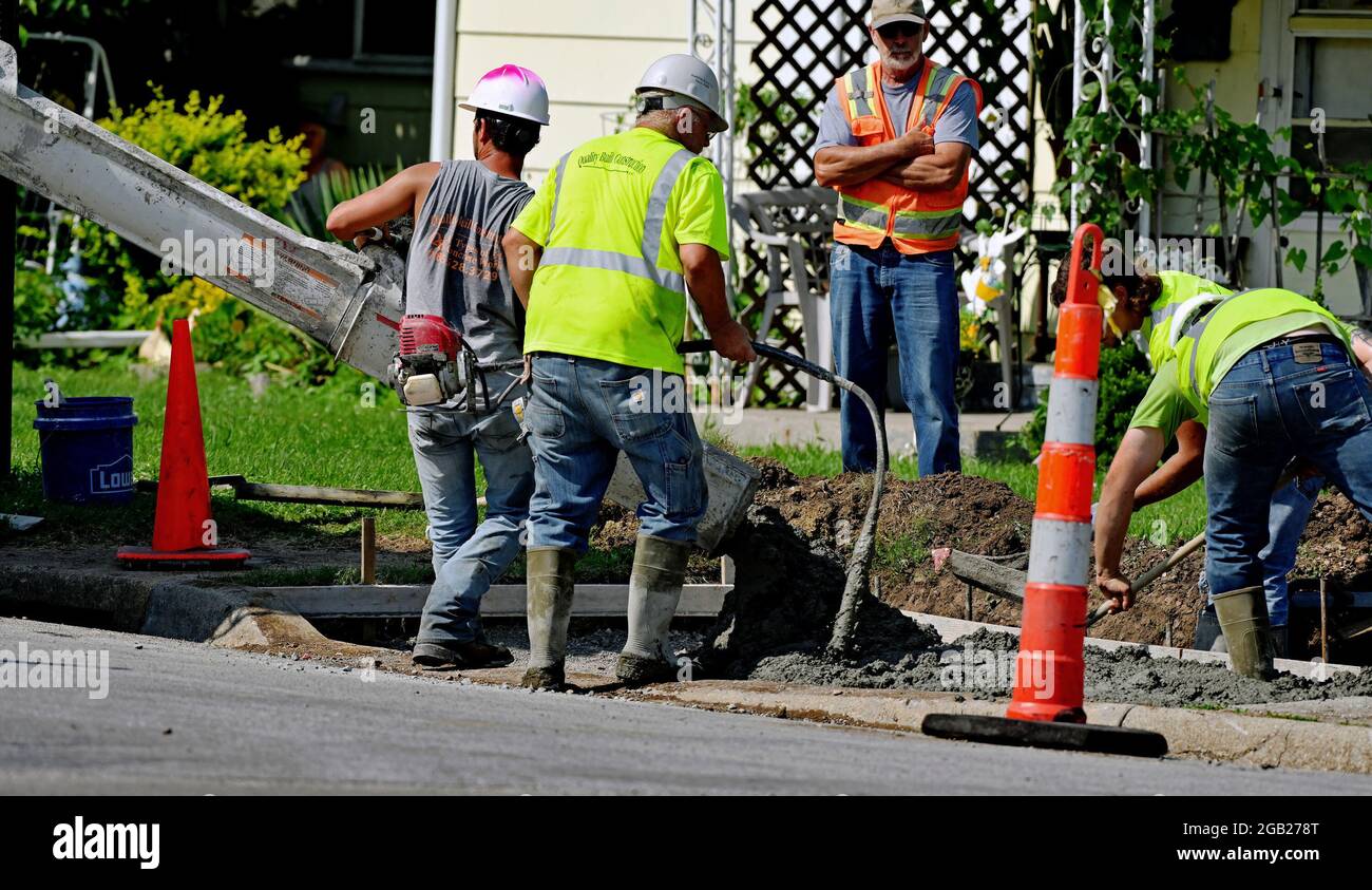 Concrete contractors working for the City of Emporia pour new concrete