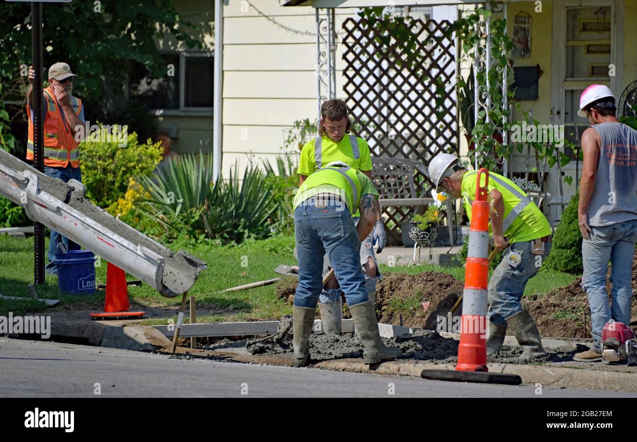 Concrete contractors working for the City of Emporia pour new concrete